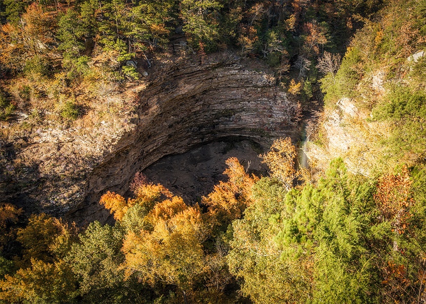 Grotto formed by Cedar Falls, seen from above. The falls are barely visible near the right end of the grotto.
